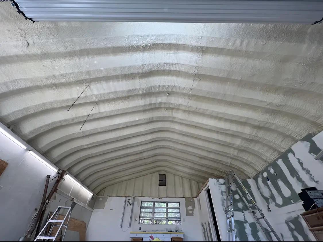 Spray polyurethane foam applied to the underside of a metal roof deck in Idylwood